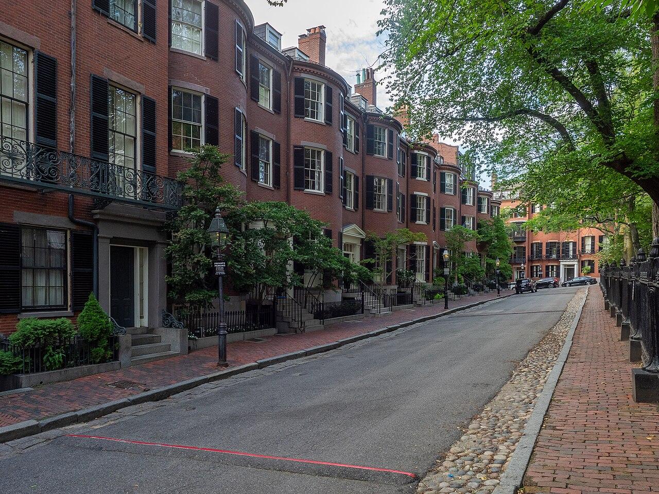 Brick homes and leafy garden edge at Louisburg Square